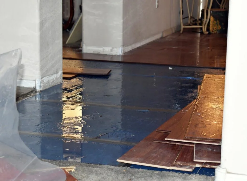 image of a flooded house with wet planks scattered around lehi ut
