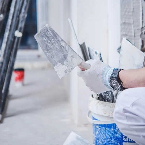 worker with gloves holding paint tools lehi ut